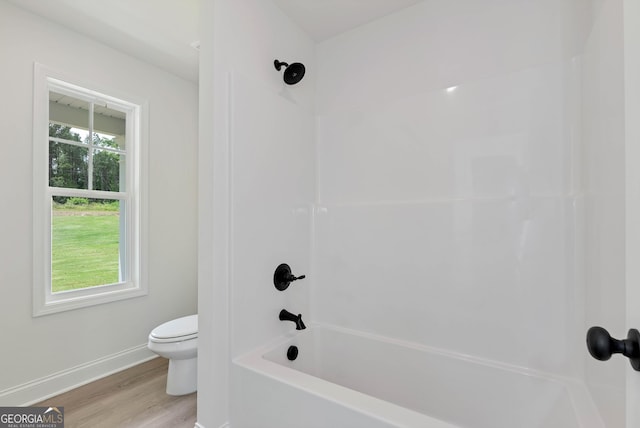 797 Ode Peppers Rd, Winder, GA 30680 - bathroom featuring shower / bathtub combination and wood finished floors