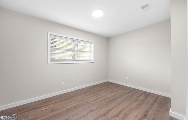6402 Kensington Ct, Austell, GA 30106 - empty room featuring wood finished floors and baseboards