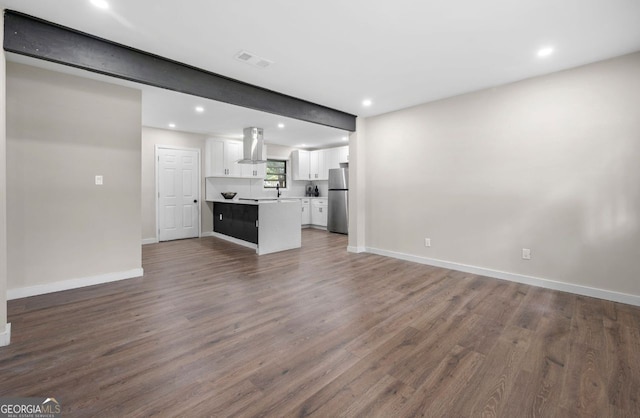 6402 Kensington Ct, Austell, GA 30106 - unfurnished living room featuring wood finished floors and recessed lighting