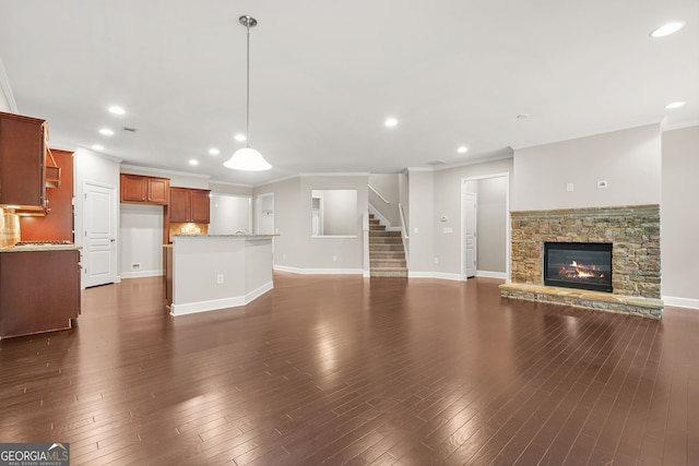 728 Lorimore Pass, Canton, GA 30115 - unfurnished living room featuring ornamental molding, a fireplace, stairway, recessed lighting, and dark wood-style flooring