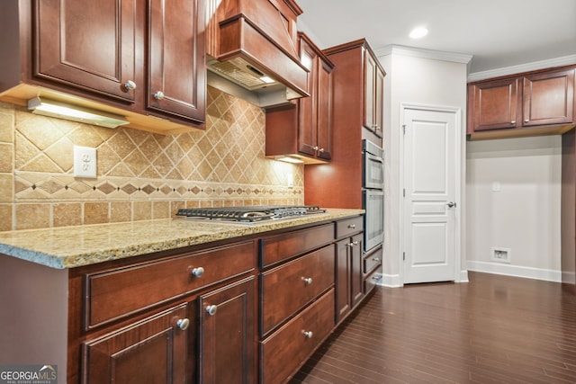 728 Lorimore Pass, Canton, GA 30115 - kitchen featuring stainless steel gas cooktop, premium range hood, light stone countertops, decorative backsplash, and dark wood-style flooring