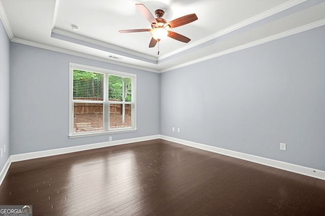 728 Lorimore Pass, Canton, GA 30115 - empty room featuring a tray ceiling, dark wood-style flooring, ceiling fan, ornamental molding, and a smoke detector