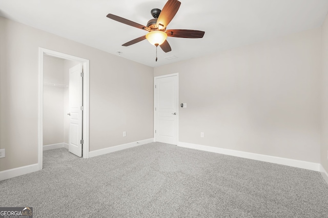728 Lorimore Pass, Canton, GA 30115 - unfurnished bedroom with carpet floors, a walk in closet, ceiling fan, and a closet