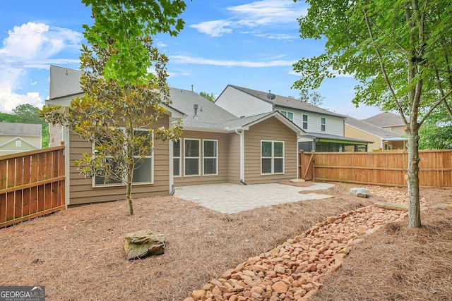 728 Lorimore Pass, Canton, GA 30115 - rear view of property with a patio, a fenced backyard, and roof with shingles