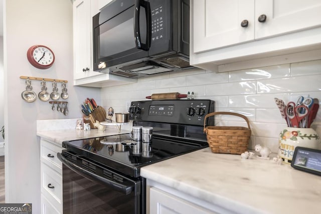 2303 Quail Ridge Ln, Perry, GA 31069 - kitchen with black appliances, decorative backsplash, and white cabinetry