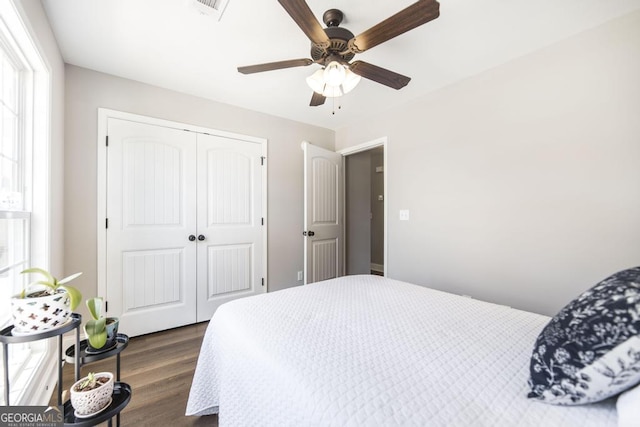 2303 Quail Ridge Ln, Perry, GA 31069 - bedroom with a closet, dark wood-style flooring, and a ceiling fan