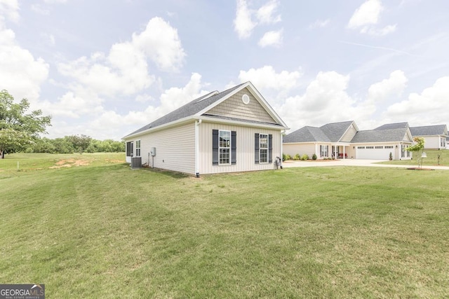 2303 Quail Ridge Ln, Perry, GA 31069 - view of front of house featuring driveway, a front yard, and board and batten siding