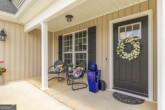 2303 Quail Ridge Ln, Perry, GA 31069 - entrance to property with a porch and board and batten siding