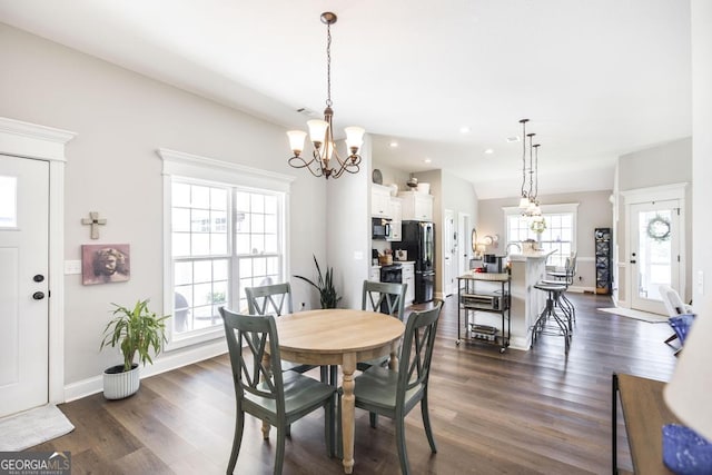 2303 Quail Ridge Ln, Perry, GA 31069 - dining space featuring a chandelier, dark wood-type flooring, and recessed lighting