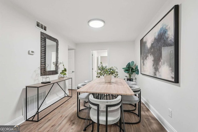 1166 Booth Rd SW Unit 301, Marietta, GA 30008 - dining space featuring wood finished floors