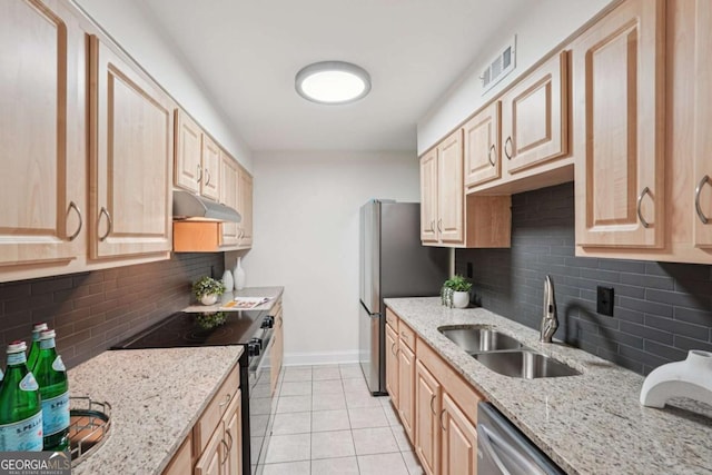 1166 Booth Rd SW Unit 301, Marietta, GA 30008 - kitchen featuring appliances with stainless steel finishes, under cabinet range hood, light brown cabinets, and decorative backsplash