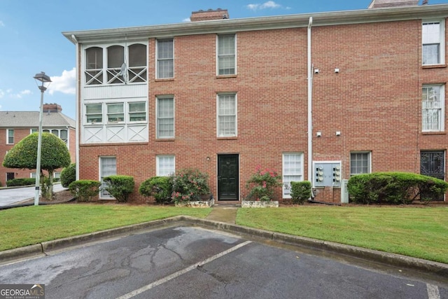 1166 Booth Rd SW Unit 301, Marietta, GA 30008 - view of property featuring uncovered parking