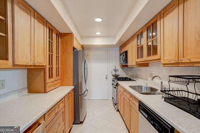 6851 Roswell Rd Unit G20, Sandy Springs, GA 30328 - kitchen featuring appliances with stainless steel finishes, light countertops, backsplash, glass insert cabinets, and recessed lighting