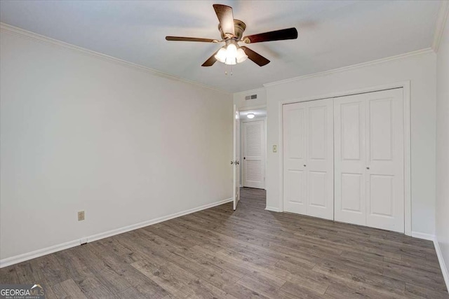 6851 Roswell Rd Unit G20, Sandy Springs, GA 30328 - unfurnished bedroom with wood finished floors, crown molding, a closet, and ceiling fan