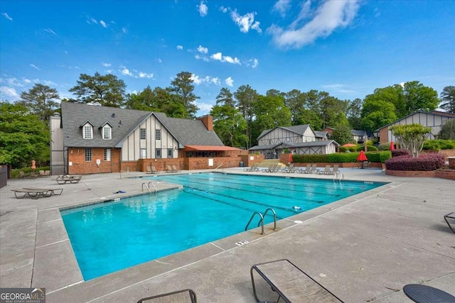 6851 Roswell Rd Unit G20, Sandy Springs, GA 30328 - community pool with a patio area and view of scattered trees