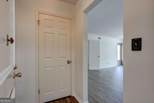 6851 Roswell Rd Unit G20, Sandy Springs, GA 30328 - hallway with dark wood-style flooring and baseboards