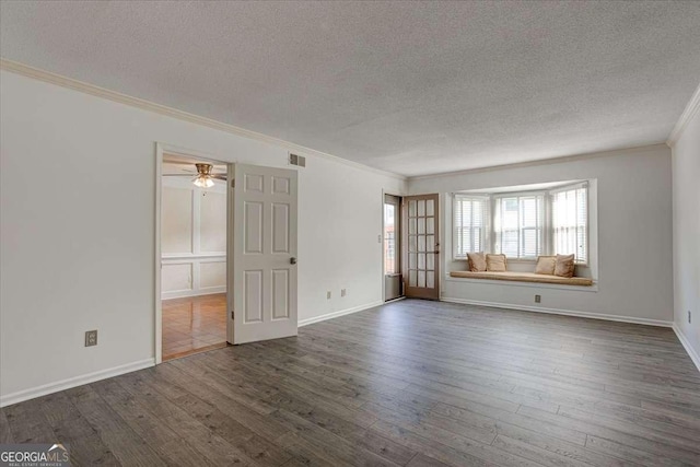 6851 Roswell Rd Unit G20, Sandy Springs, GA 30328 - unfurnished room with a textured ceiling, ornamental molding, dark wood finished floors, and a ceiling fan