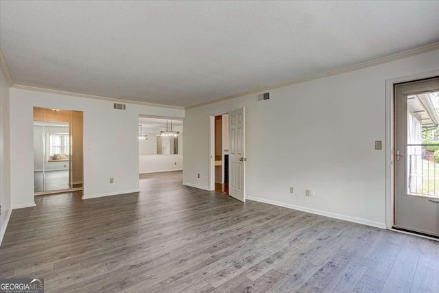 6851 Roswell Rd Unit G20, Sandy Springs, GA 30328 - unfurnished living room with ornamental molding and wood finished floors