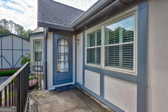6851 Roswell Rd Unit G20, Sandy Springs, GA 30328 - doorway to property with roof with shingles and stucco siding