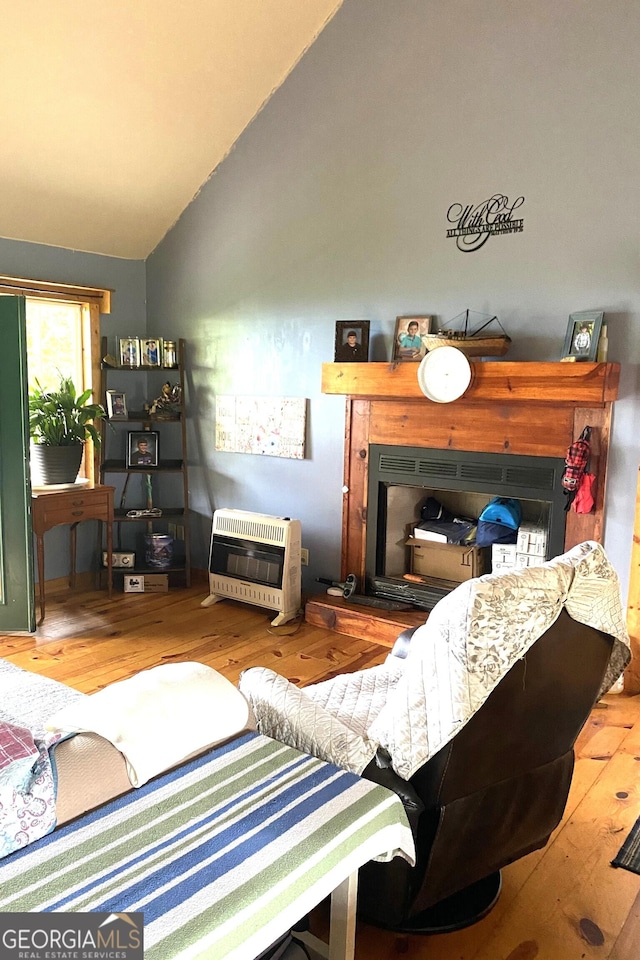 539 Dowel Cir, Ellijay, GA 30540 - living area featuring heating unit, wood finished floors, and lofted ceiling