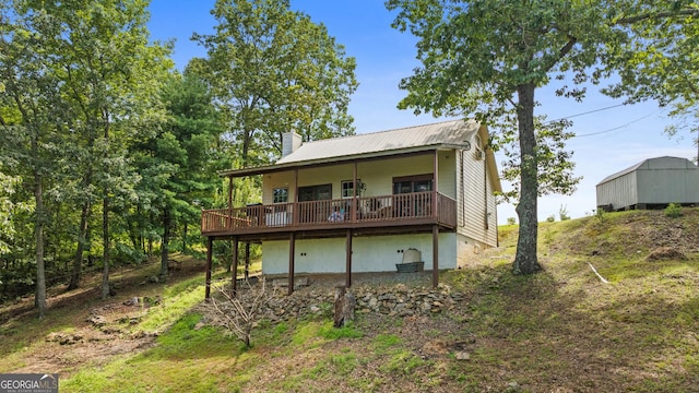 539 Dowel Cir, Ellijay, GA 30540 - rear view of property with a chimney, a deck, and a metal roof