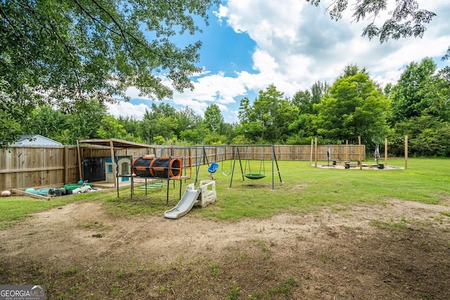 126 Sawgrass Ln, Statham, GA 30666 - fenced backyard featuring a playground and view of scattered trees