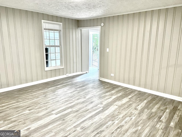 708 Degroat St, Lagrange, GA 30241 - empty room with wood finished floors and a textured ceiling