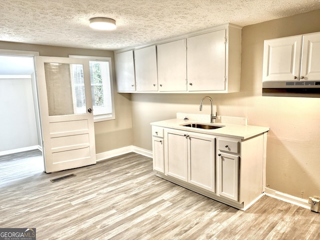 708 Degroat St, Lagrange, GA 30241 - washroom with light wood finished floors and a textured ceiling