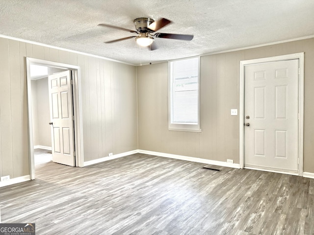 708 Degroat St, Lagrange, GA 30241 - empty room featuring a ceiling fan, wood finished floors, a textured ceiling, and ornamental molding