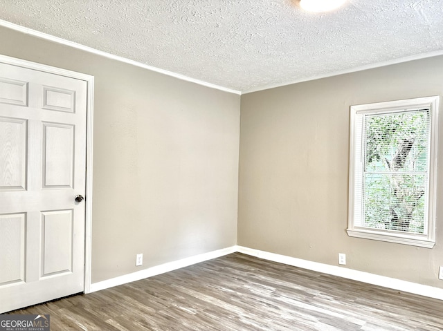 708 Degroat St, Lagrange, GA 30241 - unfurnished room featuring crown molding, a textured ceiling, and wood finished floors