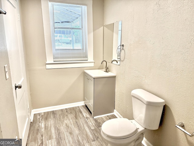 708 Degroat St, Lagrange, GA 30241 - bathroom with vanity, wood finished floors, and a textured wall