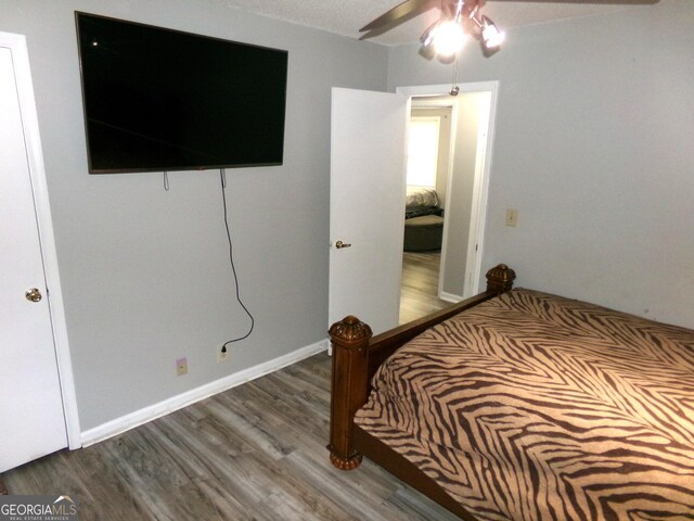 871 Chisholm Trl, Macon, GA 31220 - bedroom with wood finished floors and a ceiling fan