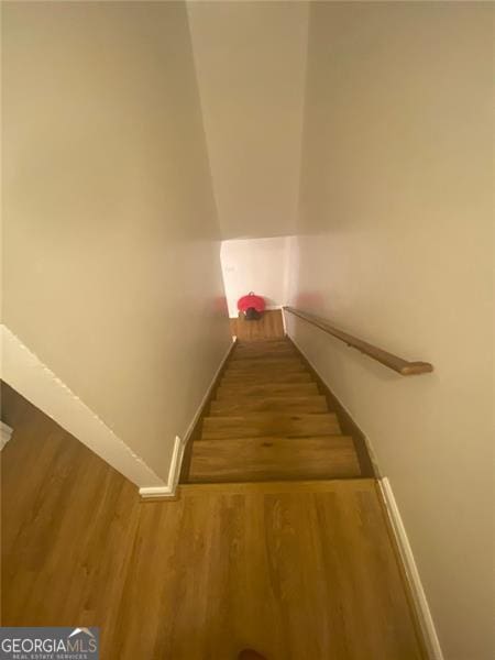 8955 Stonebridge Blvd, Douglasville, GA 30134 - stairway with wood finished floors and baseboards