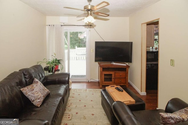 125 Pebble Beach Ct, Atlanta, GA 30349 - living area with ceiling fan and light wood finished floors