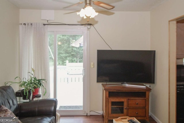 125 Pebble Beach Ct, Atlanta, GA 30349 - living room with a ceiling fan and wood finished floors