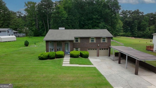 125 Pebble Beach Ct, Atlanta, GA 30349 - view of front of property featuring concrete driveway, an attached garage, a front lawn, and brick siding