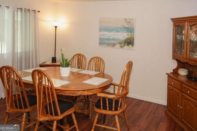 125 Pebble Beach Ct, Atlanta, GA 30349 - dining room with dark wood-style floors and baseboards