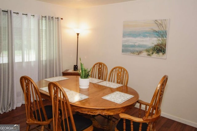 125 Pebble Beach Ct, Atlanta, GA 30349 - dining area featuring wood finished floors and baseboards