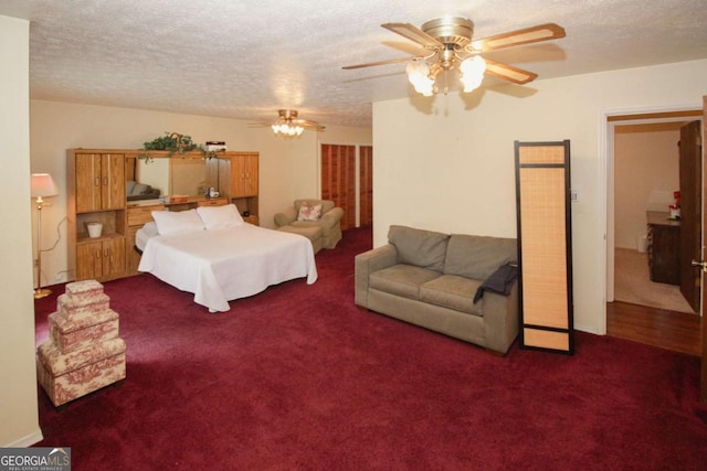 125 Pebble Beach Ct, Atlanta, GA 30349 - bedroom with carpet, a textured ceiling, and a ceiling fan