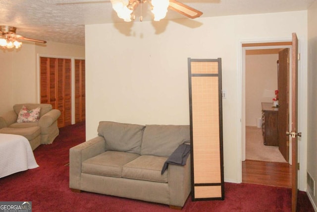125 Pebble Beach Ct, Atlanta, GA 30349 - carpeted living room with ceiling fan