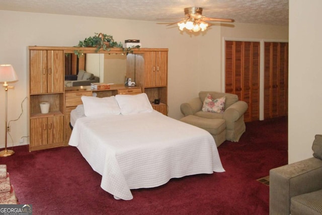 125 Pebble Beach Ct, Atlanta, GA 30349 - carpeted bedroom with ceiling fan and a textured ceiling