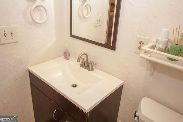 125 Pebble Beach Ct, Atlanta, GA 30349 - bathroom featuring vanity and toilet