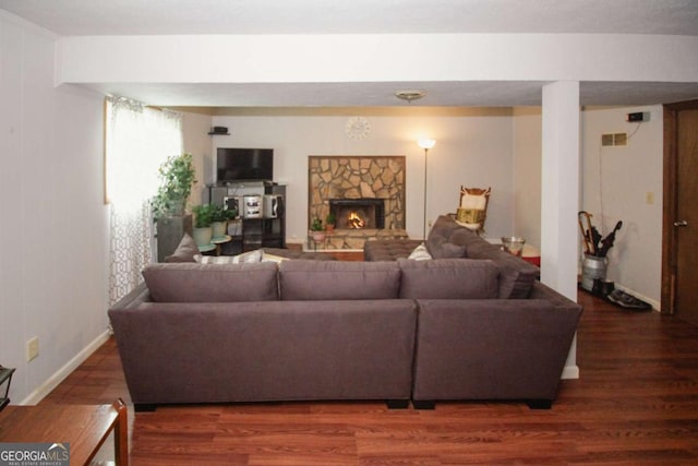 125 Pebble Beach Ct, Atlanta, GA 30349 - living room with wood finished floors and a stone fireplace