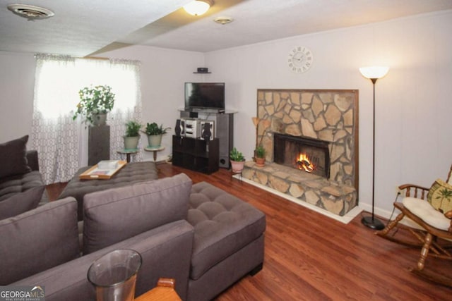 125 Pebble Beach Ct, Atlanta, GA 30349 - living area featuring wood finished floors and a stone fireplace