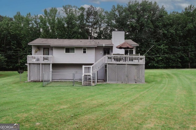 125 Pebble Beach Ct, Atlanta, GA 30349 - back of property featuring stairway, a wooden deck, a yard, and a chimney