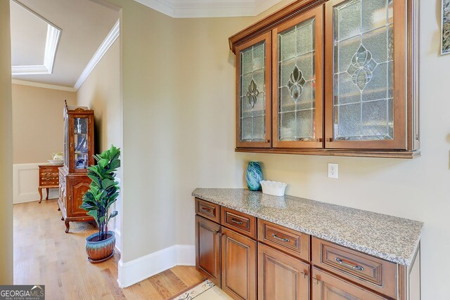 805 Cog Hl, Mcdonough, GA 30253 - bar featuring light wood-style flooring and crown molding
