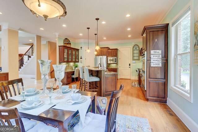 805 Cog Hl, Mcdonough, GA 30253 - dining area featuring ornamental molding, light wood-style flooring, stairs, and recessed lighting