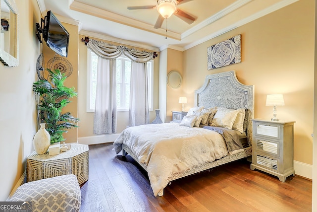 805 Cog Hl, Mcdonough, GA 30253 - bedroom with dark wood-type flooring, a tray ceiling, and ornamental molding