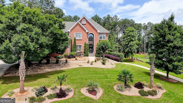 805 Cog Hl, Mcdonough, GA 30253 - view of front facade with a front lawn, brick siding, and roof with shingles