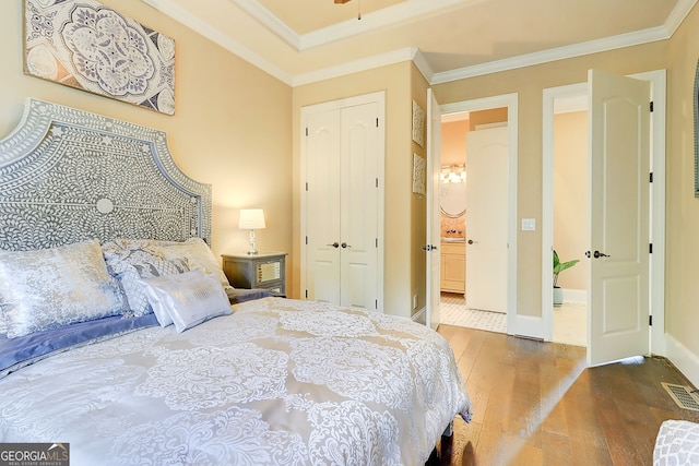 805 Cog Hl, Mcdonough, GA 30253 - bedroom with wood finished floors, a closet, and crown molding